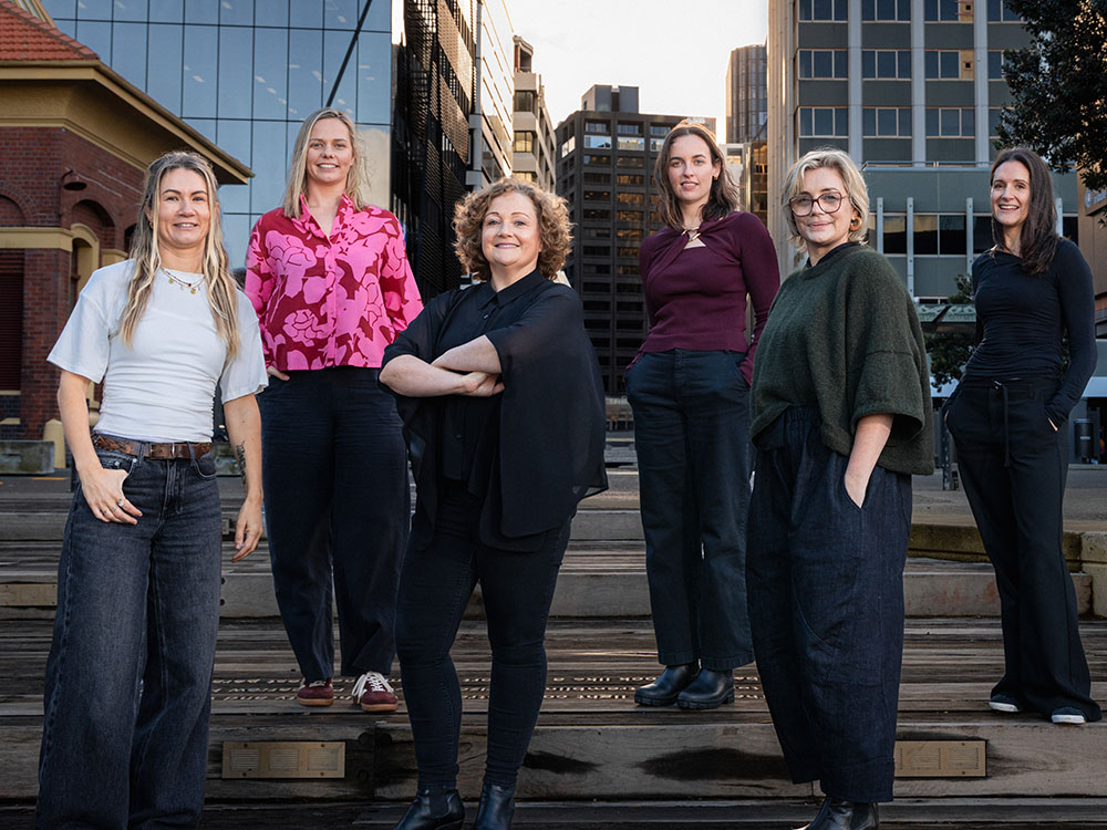 Virtual Marketers team standing together outdoors - Get in touch with our NZ virtual marketing team