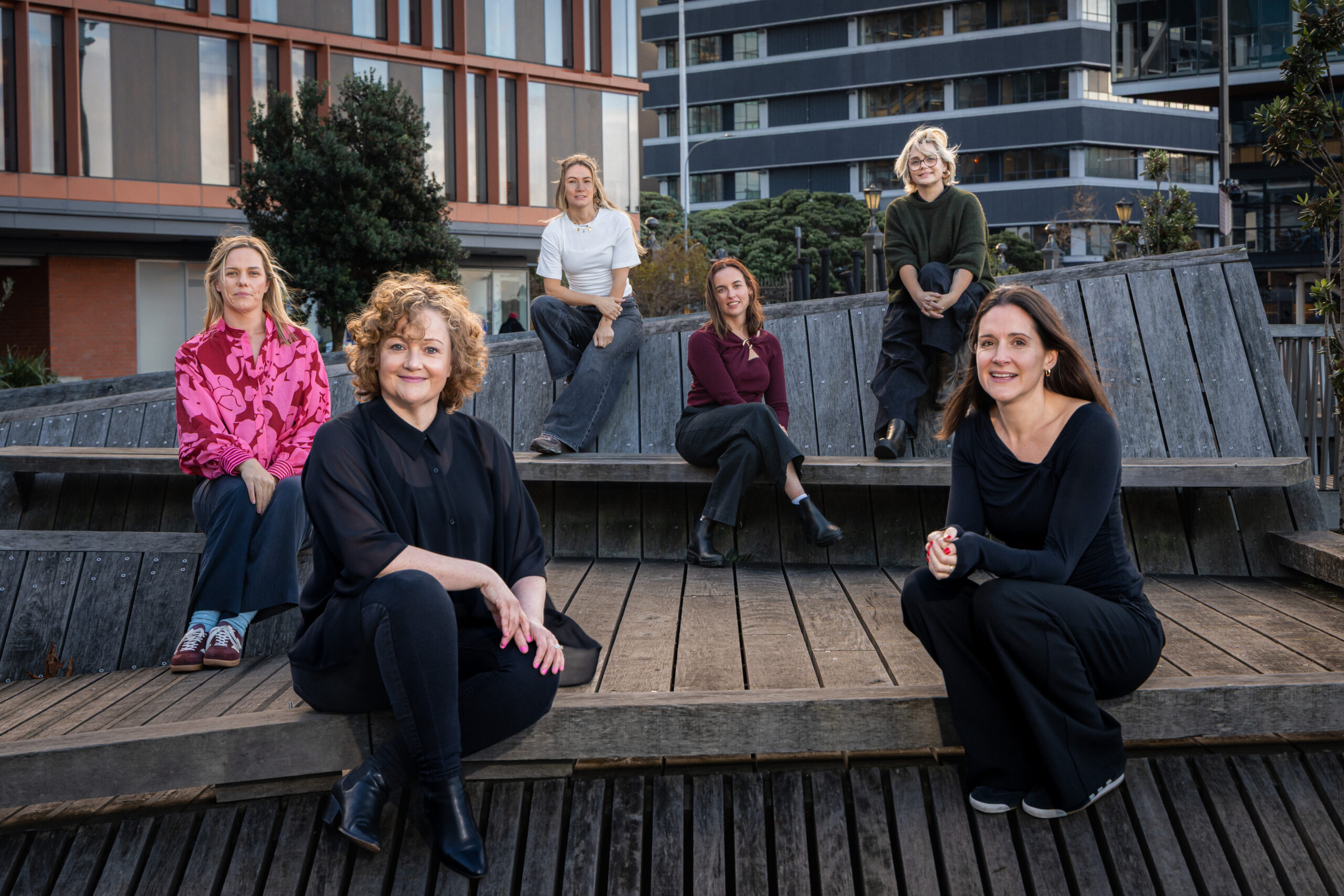 Virtual Marketers team seated together outdoors in the city - Marketing insights and resources from NZ based marketing specialists