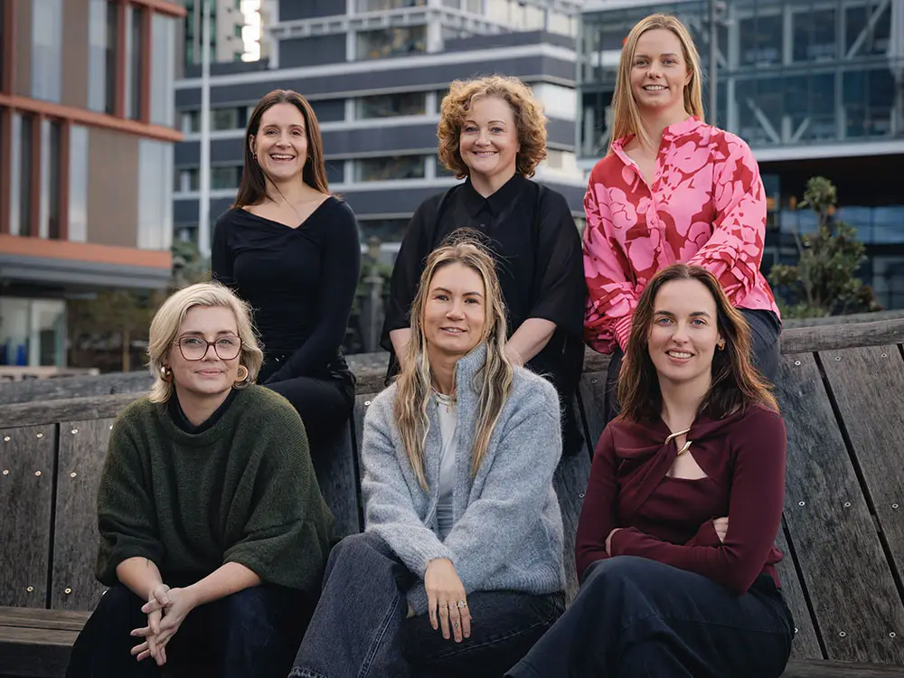 Virtual Marketers team seated together outdoors - NZ based marketing specialists