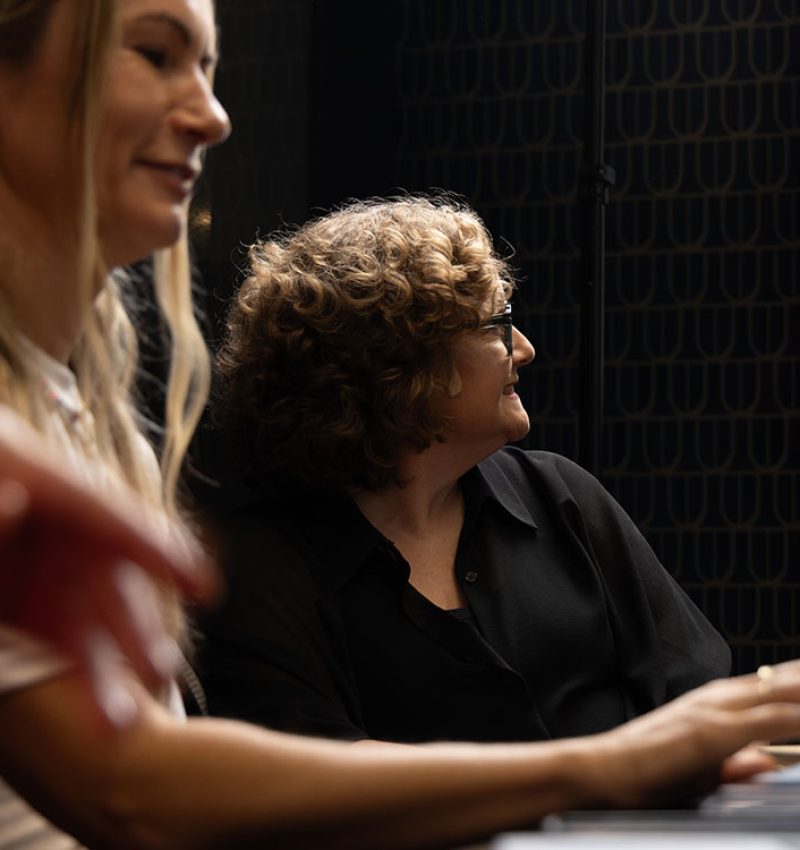 Two marketers discussing campaign results in the studio - Digital advertising agency and campaign management NZ